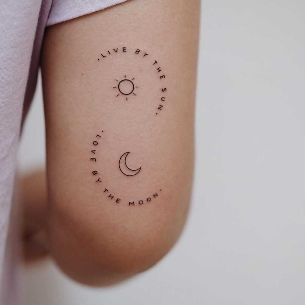 Солнце и луна с надписью - тату для девушки возле локтя в стиле минимализм
